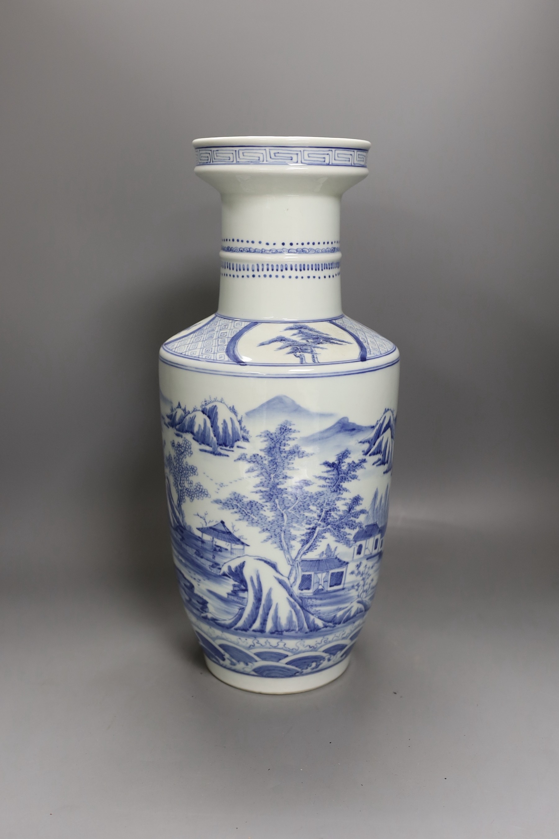 A Chinese blue and white rouleau vase, Kangxi mark but later 40cm